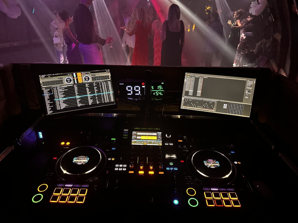 DIS2GO DJ console with the dance floor beyond